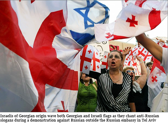 sraelis of Georgian origin wave both Georgian and Israeli flags as they chant anti-Russian slogans during a demonstration against Russian military action in Georgia outside the Russian embassy in Tel Aviv on August 11, 2008 israelis-of-Georgian.jpg