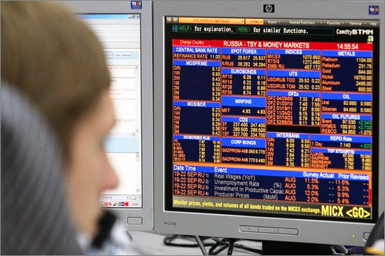 A trader looks at a monitor during a tradeing session at Alfa Bank in Moscow on September 19, 2008. Trading was suspended on Russian stock markets after share prices soared minutes after the exchanges opened following a massive government rescue plan, market officials said. Russian-stock.jpg