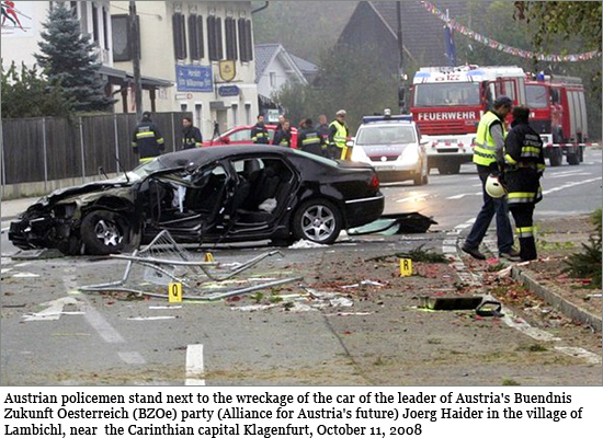 Austrian policemen stand next to the wreckage of the car of the leader of Austria's Buendnis Zukunft Oesterreich (BZOe) party (Alliance for Austria's future) Joerg Haider in the village of Lambichl, near the Carinthian capital Klagenfurt, October 11, 2008 haider_550.jpg