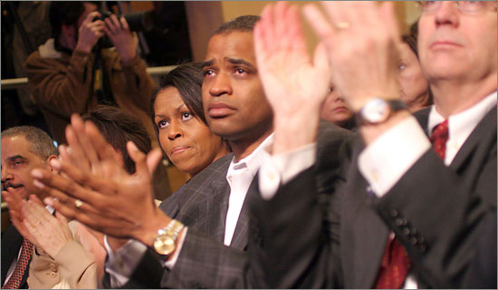 Michelle Obama, at left, and Marti Nesbitt, a family friend, listening to Senator Barack Obama's speech in Philadelphia. (Jessica Kourkounis for The New York Times) obama_is.jpg
