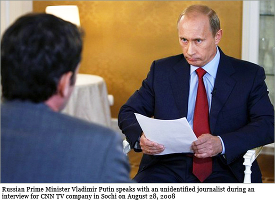 Russian Prime Minister Vladimir Putin (R) speaks with an unidentified journalist during an interview for CNN TV company in Sochi on August 28, 2008. putin_cnn.jpg