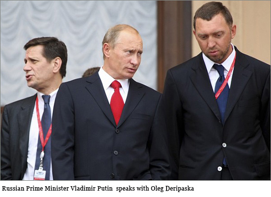 Russian Prime Minister Vladimir Putin (L) speaks with Oleg Deripaska, head of "The base element" company at the International Investment Forum in Sochi on September 19, 2008. Putin rejected the prospect of a new Cold War with the West and said Russia wanted further integration into the world economy. russia_cds.jpg