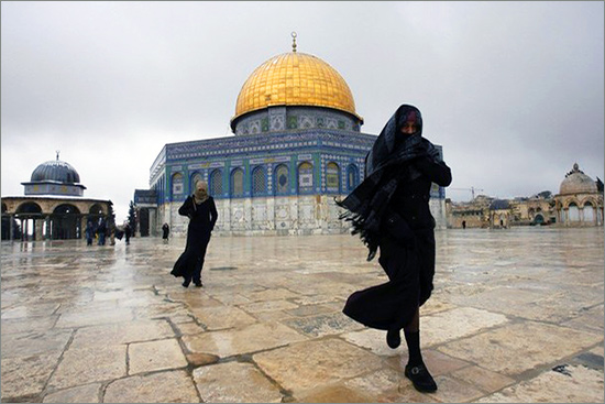 People walk near the Dome of the Rock on the compound known to Muslims as al-Haram al-Sharif, and to Jews as Temple Mount, after snowfall in Jerusalem's Old City February 19, 2008. the-Temple-Mount2.jpg