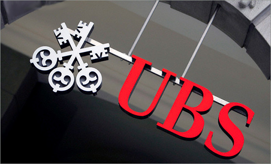The logo of Swiss Bank UBS on Zurichs Bahnhofstrasse. Switzerland's largest bank announced an extra 4 billion US dollars or 2.70 billion euros writedown bringing the total cost arising from the collapsed United States subprime mortgage sector to 18.4 billion US dollars or 12.43 billion euros. ubs.jpg